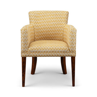 Belle side chair upholstered in mustard yellow geometric fabric with dark wooden legs