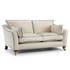 Chadwick Sofa upholstered in cream fabric with contrast piping, loose side and back cushions, and brass castors