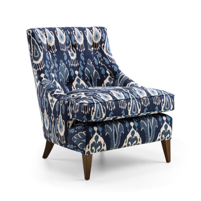 Harper chair upholstered in blue and white patterned fabric with wooden legs