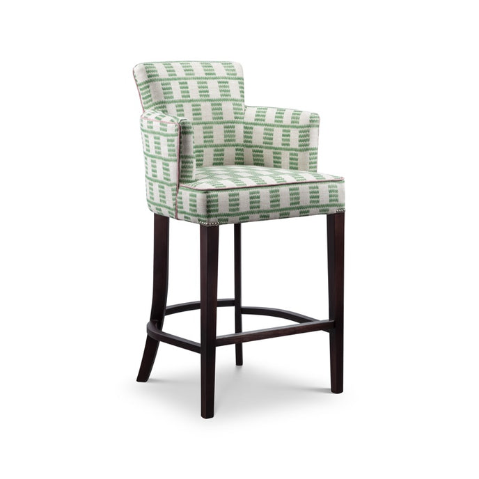 Milan Bar Stool upholstered in green and white geometric fabric with dark wooden legs and curved stretchers
