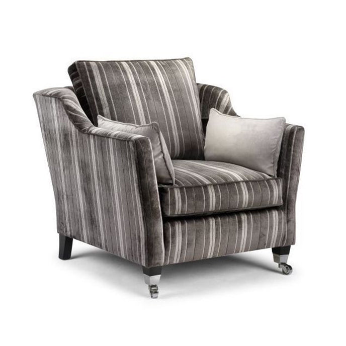 Minster Knole Armchair upholstered in grey striped velvet with dark wooden legs, chrome castors, and contrasting cushions