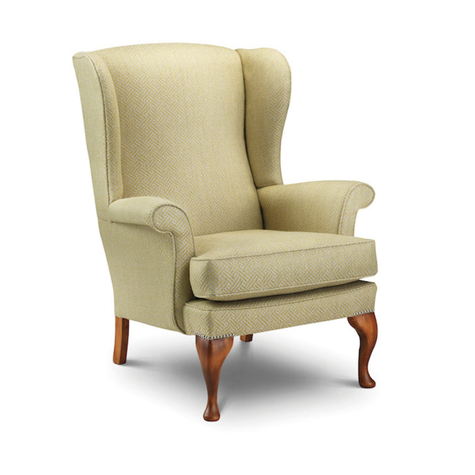 Traditional Oakham Wing Chair upholstered in beige fabric with wooden legs