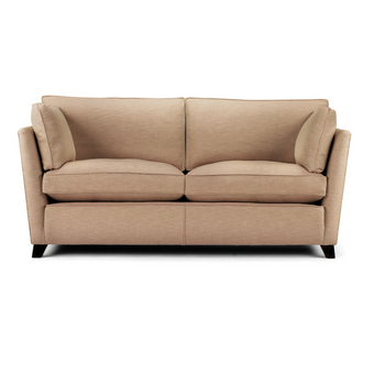 Oxford Sofa upholstered in beige fabric with angular arms and dark wooden legs
