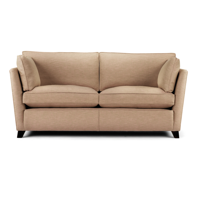 Oxford Sofa upholstered in beige fabric with angular arms and dark wooden legs