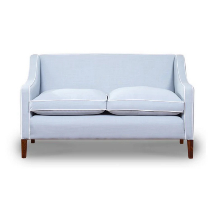 Snug sofa in light blue with wooden legs