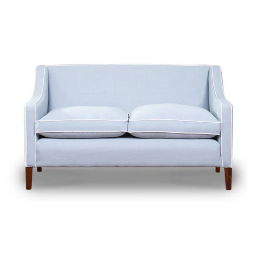 Snug sofa in light blue with wooden legs