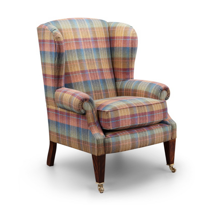 Classic Wing Chair upholstered in multicoloured plaid fabric with wooden legs