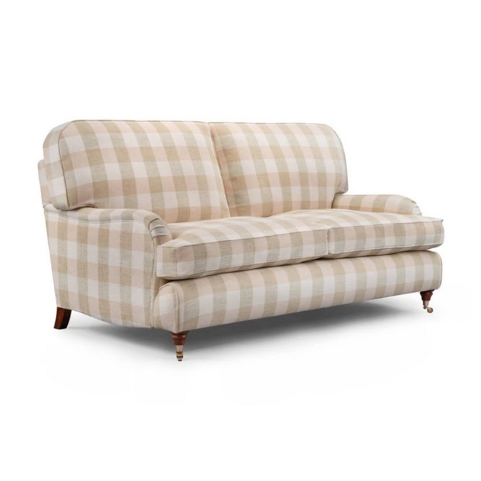 Howard Sofa upholstered in beige checked fabric with rolled arms, turned wooden legs, and brass castors
