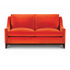 Ritz Sofa upholstered in bright orange velvet with loose back cushions and dark wooden legs